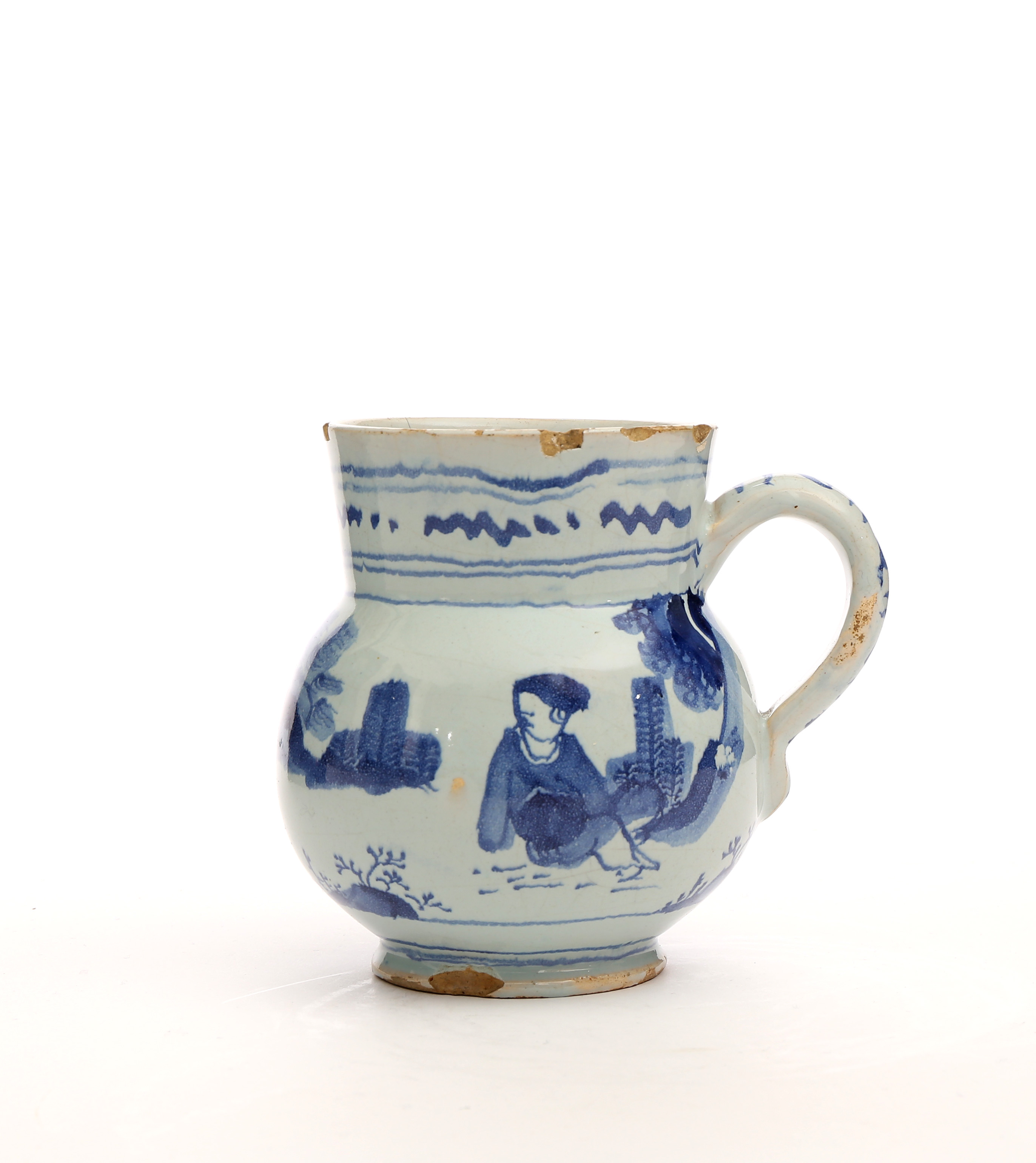 AN ENGLISH DELFT BLUE AND WHITE SMALL MUG