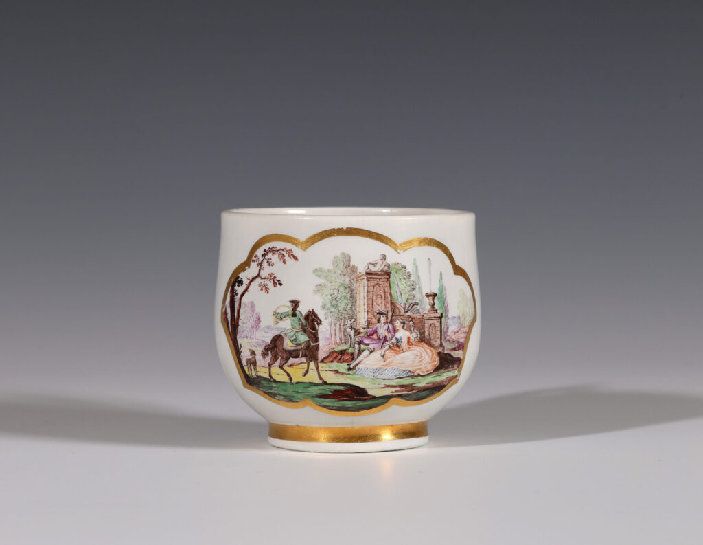 A TIN-GLAZED CUP PROBABLY VINCENNES
