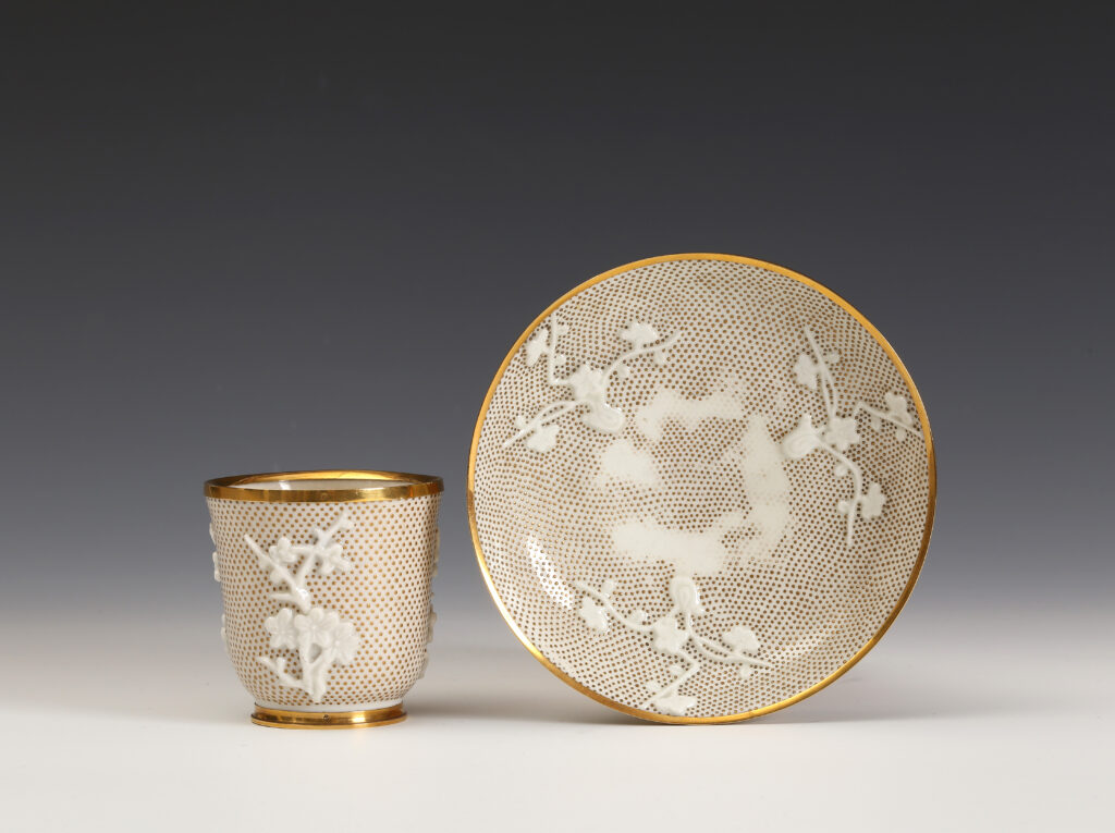 A GOLD-MOUNTED PIQUÉE D’OR CHINESE, BLANC DE CHINE, BEAKER AND SAINT-CLOUD PORCELAIN SAUCER