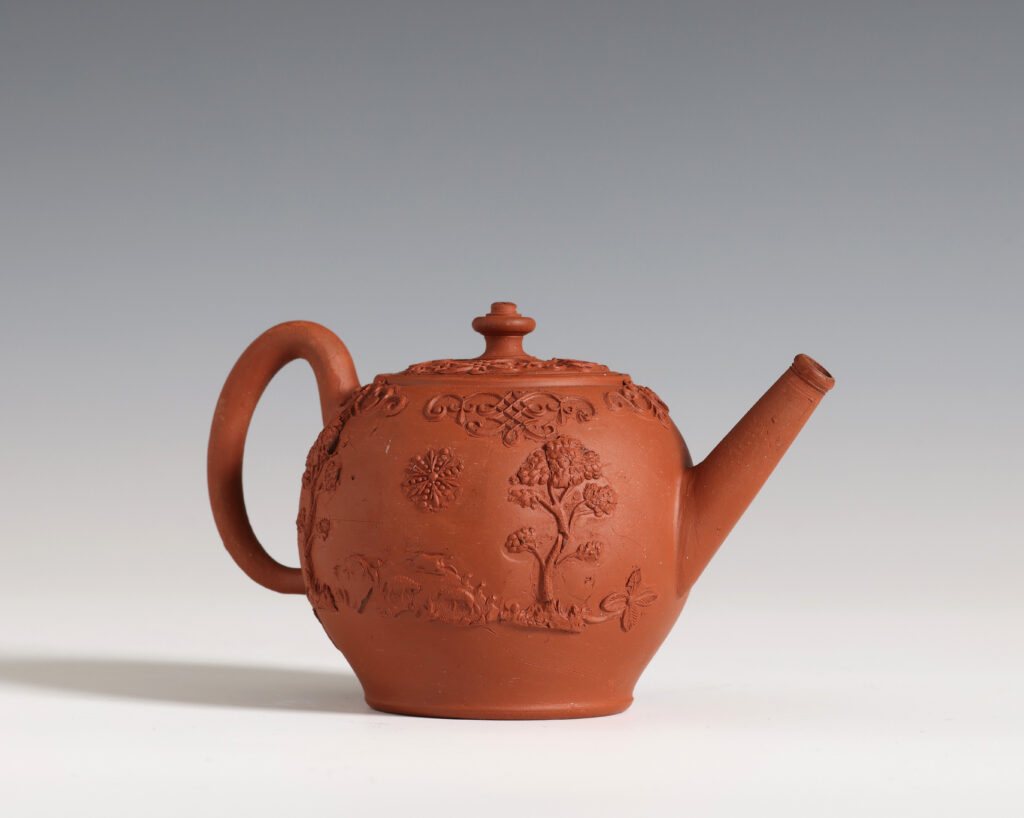 A SMALL STAFFORDSHIRE REDWARE TEAPOT