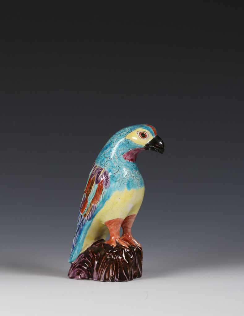 A COLOURED SALT-GLAZED STONEWARE HAWK