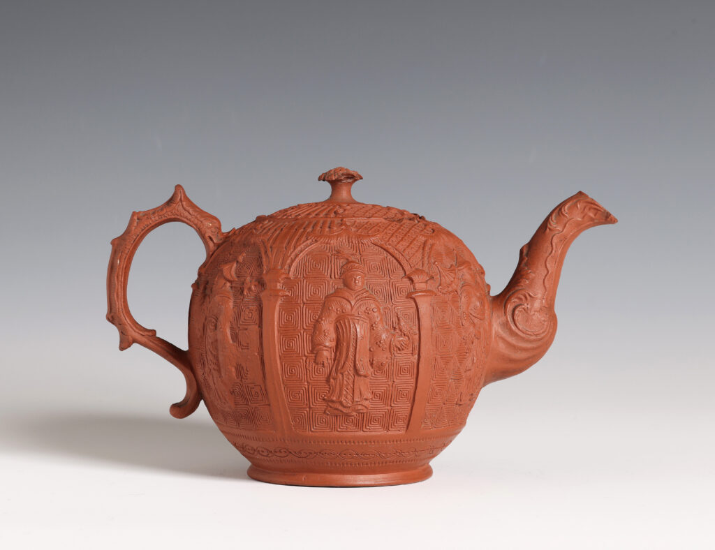 A STAFFORDSHIRE RED STONEWARE CHINOISERIE TEAPOT