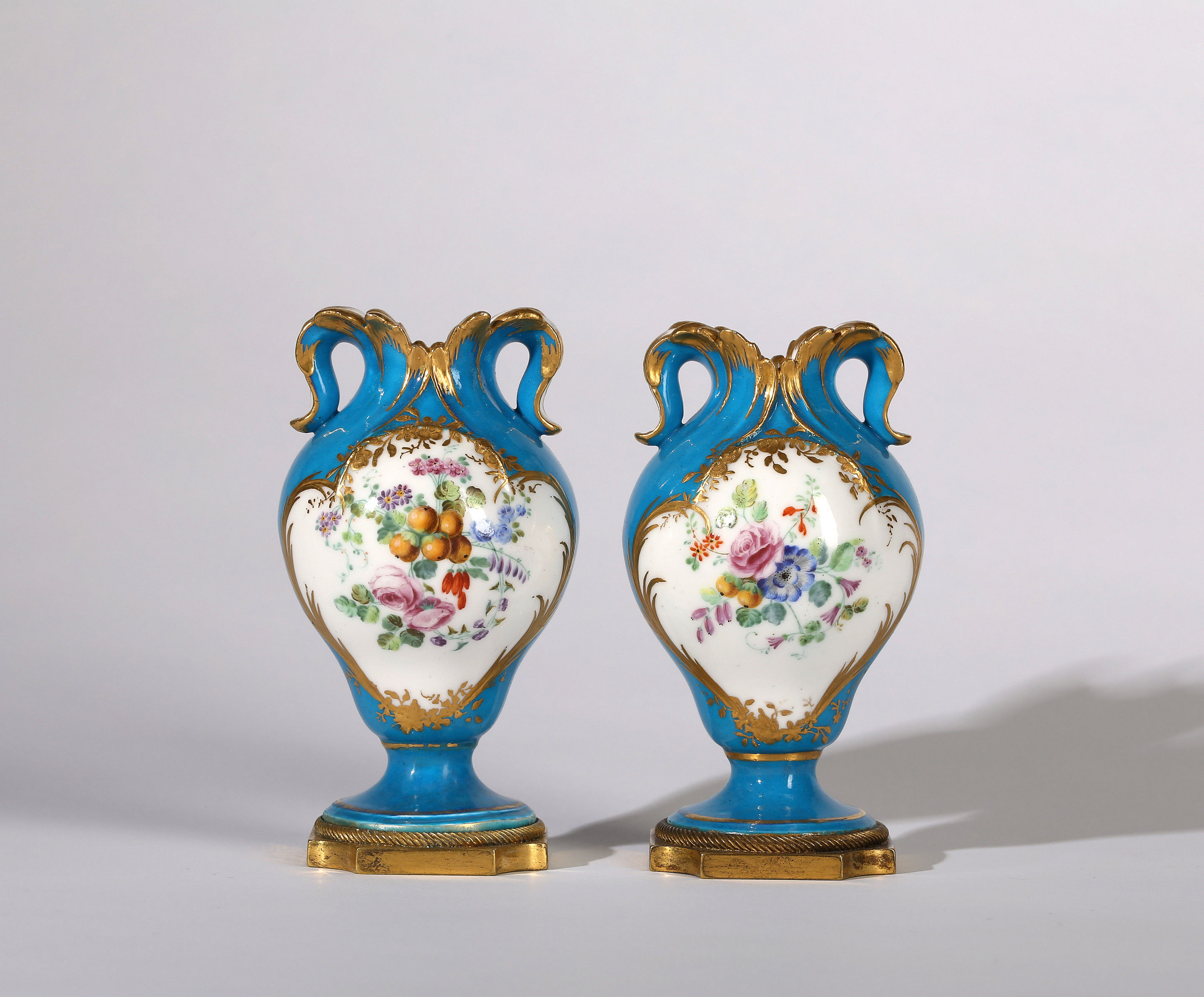 A PAIR OF VINCENNES OR SÈVRES BLEU CELESTE SMALL VASES À OREILLES